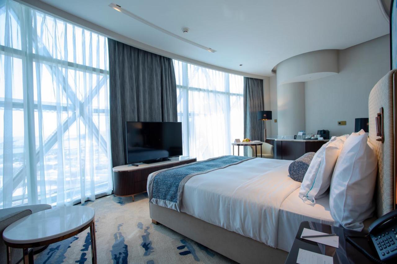 Century Marina Hotel - Lusail Exteriör bild A bedroom at the hotel