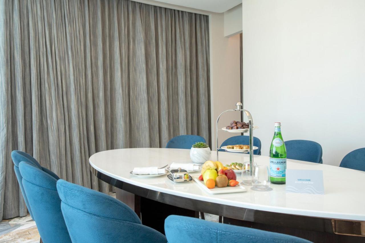 Century Marina Hotel - Lusail Exteriör bild A table with a bottle of mineral water