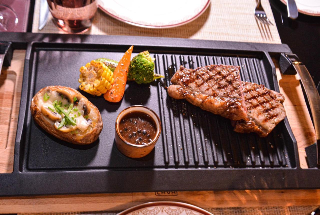 Century Marina Hotel - Lusail Exteriör bild A steak prepared on a griddle